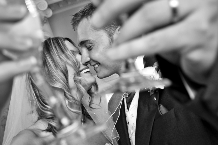 Newlyweds with celebratory drinks | York wedding photographer